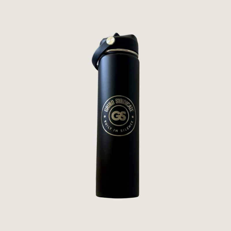 Grind Syndicate 700ml insulated steel bottle on a plain bone background