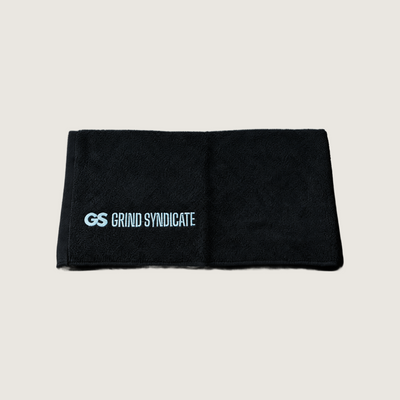 Grind Syndicate towel in Iced Blue on a plain bone background